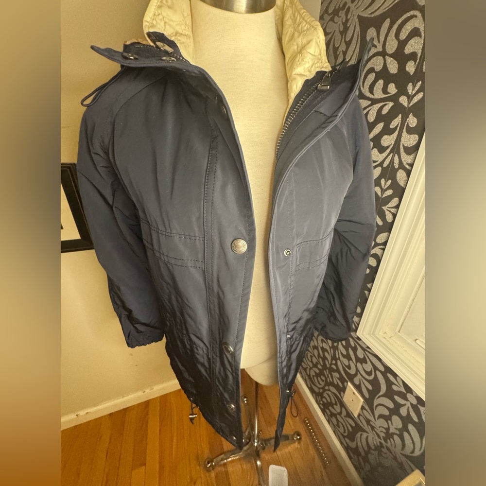 2 in 1 Coach hooded rain jacket with detachable vest in cream.